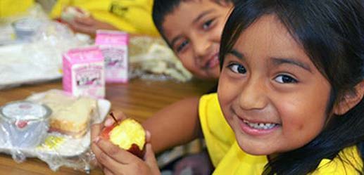 photo of children at school lunch table